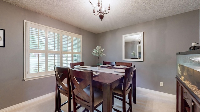 1335 Chippendale Cir, Columbia, TN 38401 - dining space featuring healthy amount of natural light, a textured ceiling, light colored carpet, and a chandelier
