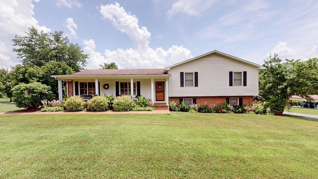 1335 Chippendale Cir, Columbia, TN 38401 - split level home with a front lawn, covered porch, and brick siding