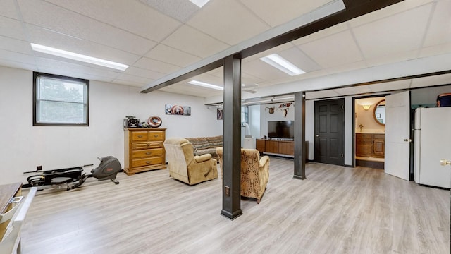 1335 Chippendale Cir, Columbia, TN 38401 - below grade area with freestanding refrigerator and light wood-style flooring