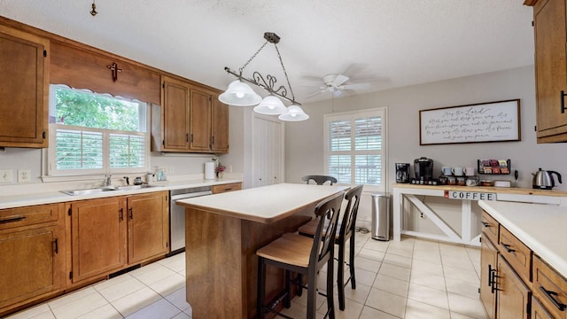 1335 Chippendale Cir, Columbia, TN 38401 - kitchen featuring stainless steel dishwasher, brown cabinets, and light countertops