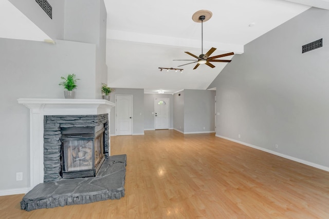 2910 Churchill Ln, Thompsons Station, TN 37179 - unfurnished living room with a ceiling fan, light wood-type flooring, and a fireplace