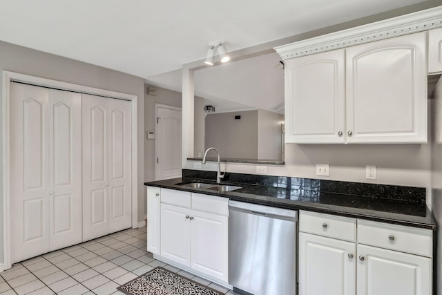 2910 Churchill Ln, Thompsons Station, TN 37179 - kitchen featuring stainless steel dishwasher, light tile patterned floors, white cabinets, and dark stone counters