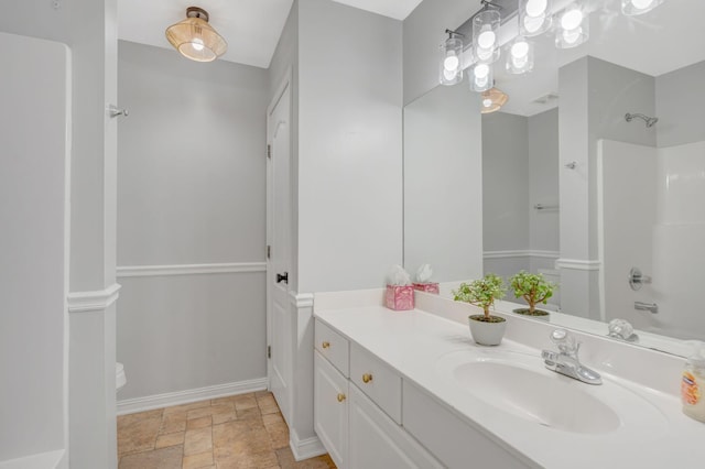 2910 Churchill Ln, Thompsons Station, TN 37179 - bathroom featuring stone finish flooring, vanity, and washtub / shower combination