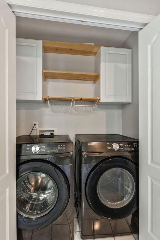 2910 Churchill Ln, Thompsons Station, TN 37179 - laundry room featuring cabinet space, washing machine and clothes dryer, and tile patterned floors