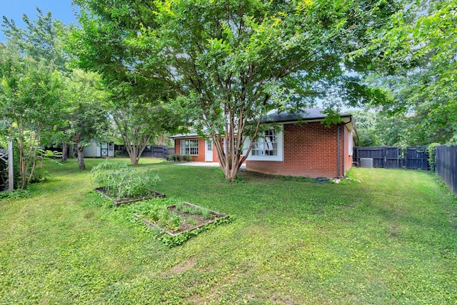 2910 Churchill Ln, Thompsons Station, TN 37179 - fenced yard featuring a vegetable garden