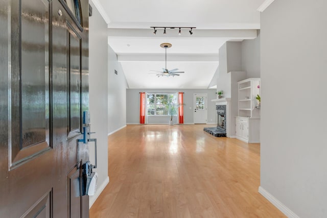 2910 Churchill Ln, Thompsons Station, TN 37179 - entryway with a ceiling fan, light wood finished floors, and a fireplace with raised hearth