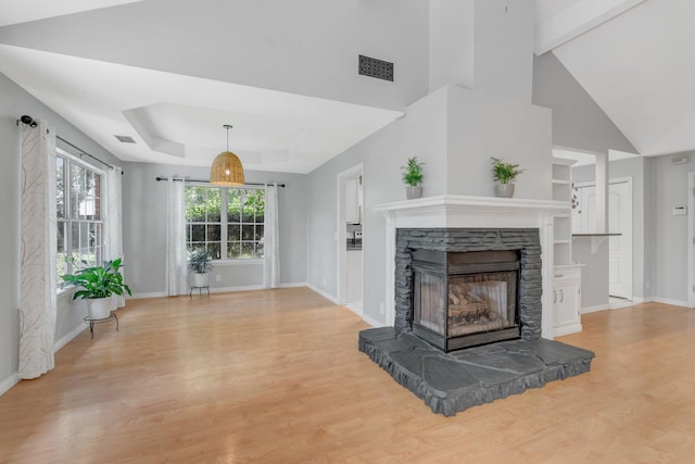 2910 Churchill Ln, Thompsons Station, TN 37179 - unfurnished living room with a fireplace, light wood-style floors, beamed ceiling, and high vaulted ceiling
