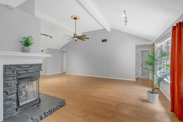 2910 Churchill Ln, Thompsons Station, TN 37179 - unfurnished living room with ceiling fan, light wood finished floors, and a fireplace
