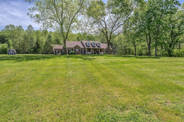 2600 Little Bartons Creek Rd, Cumberland Furnace, TN 37051 - view of grassy yard featuring a storage shed
