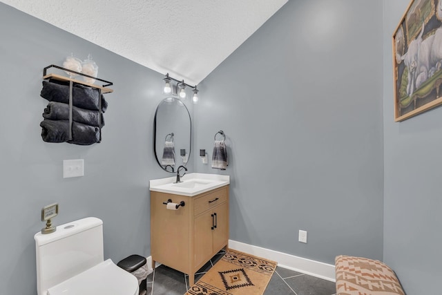 2600 Little Bartons Creek Rd, Cumberland Furnace, TN 37051 - bathroom with vanity, a textured ceiling, tile patterned flooring, and lofted ceiling