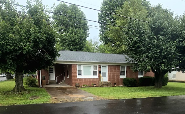 501 6th St, Lawrenceburg, TN 38464 - single story home featuring entry steps, driveway, brick siding, a carport, and a front yard