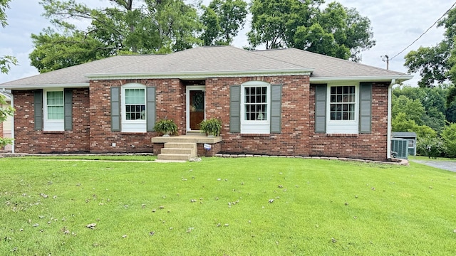 653 Albany Dr, Hermitage, TN 37076 - view of front of house featuring a front lawn, brick siding, and a shingled roof