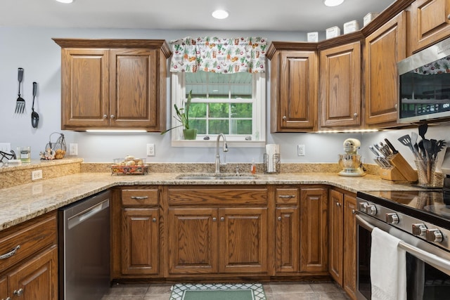 1550 Beech Bottom Rd, Watertown, TN 37184 - kitchen featuring appliances with stainless steel finishes, light stone counters, brown cabinets, and recessed lighting