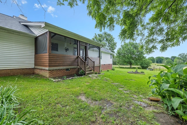 1550 Beech Bottom Rd, Watertown, TN 37184 - view of green lawn featuring a sunroom and ceiling fan