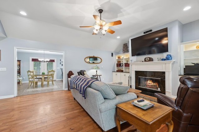 1550 Beech Bottom Rd, Watertown, TN 37184 - living area featuring lofted ceiling, ceiling fan, light wood finished floors, a chandelier, and a high end fireplace