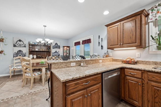 1550 Beech Bottom Rd, Watertown, TN 37184 - kitchen with stainless steel dishwasher, a chandelier, a peninsula, light tile patterned flooring, and brown cabinets