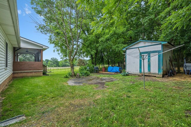 1550 Beech Bottom Rd, Watertown, TN 37184 - view of green lawn featuring a shed and a sunroom