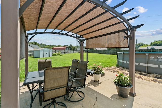 1620 Baucom Dr, Columbia, TN 38401 - fenced backyard featuring a storage unit, outdoor dining area, a patio area, and a pergola