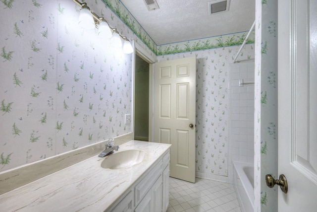 2010 Hartland Rd, Franklin, TN 37069 - full bath featuring wallpapered walls, vanity, a textured ceiling, tile patterned floors, and shower / tub combination