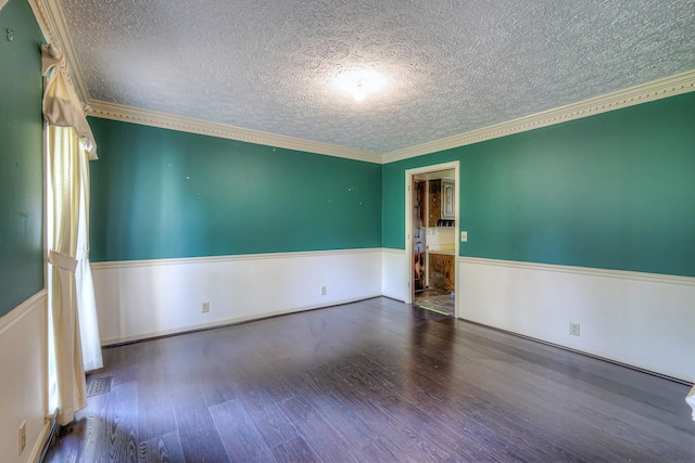 2010 Hartland Rd, Franklin, TN 37069 - spare room featuring a textured ceiling, a wainscoted wall, wood finished floors, and crown molding
