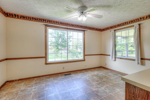 2010 Hartland Rd, Franklin, TN 37069 - empty room featuring plenty of natural light, a ceiling fan, and a textured ceiling