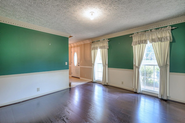 2010 Hartland Rd, Franklin, TN 37069 - unfurnished room featuring ornamental molding, a textured ceiling, plenty of natural light, and wood finished floors
