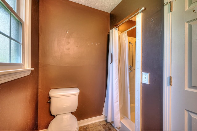 2010 Hartland Rd, Franklin, TN 37069 - full bathroom featuring a shower with curtain and a textured ceiling