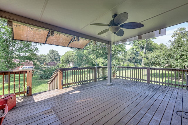 2010 Hartland Rd, Franklin, TN 37069 - wooden terrace featuring view of wooded area, ceiling fan, and a yard