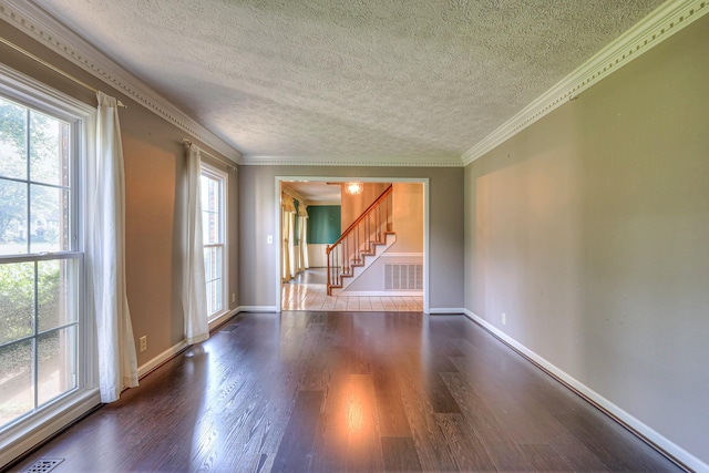 2010 Hartland Rd, Franklin, TN 37069 - unfurnished room featuring stairs, dark wood-style floors, a textured ceiling, and crown molding