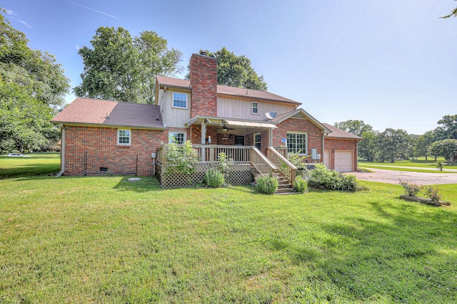 2010 Hartland Rd, Franklin, TN 37069 - rear view of house featuring an attached garage, driveway, brick siding, and a chimney