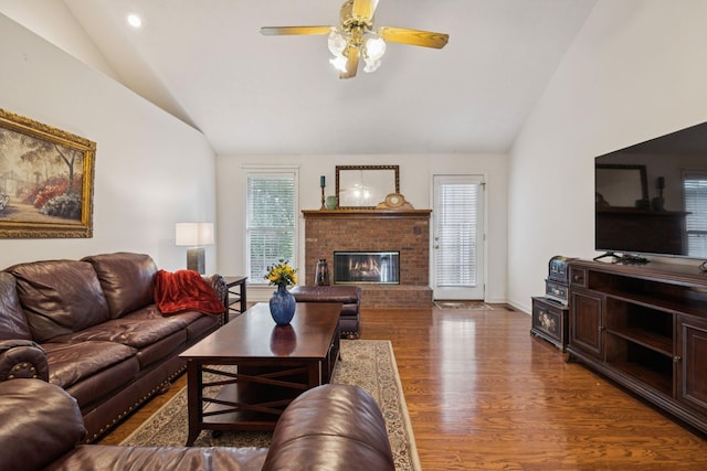 217 Fox Hunt Ln, Lebanon, TN 37087 - living room with vaulted ceiling, a brick fireplace, wood finished floors, and a ceiling fan