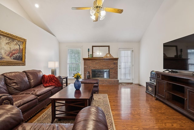 217 Fox Hunt Ln, Lebanon, TN 37087 - living area featuring vaulted ceiling, wood finished floors, a brick fireplace, and ceiling fan