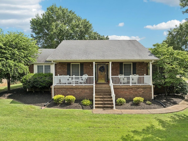 217 Fox Hunt Ln, Lebanon, TN 37087 - view of front of home with covered porch, brick siding, and a front yard