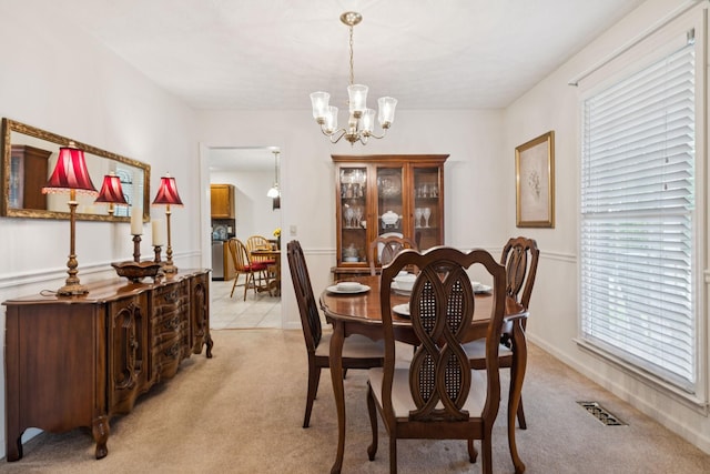 217 Fox Hunt Ln, Lebanon, TN 37087 - dining area with a chandelier, light carpet, and plenty of natural light