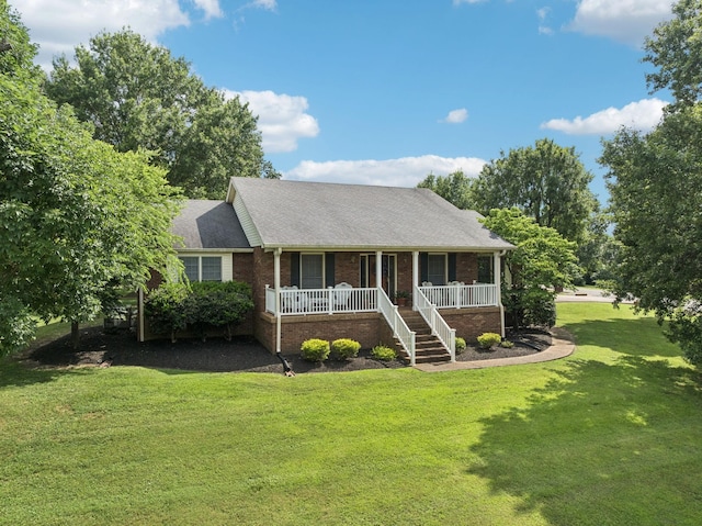 217 Fox Hunt Ln, Lebanon, TN 37087 - ranch-style house with a porch, brick siding, a front yard, roof with shingles, and stairway
