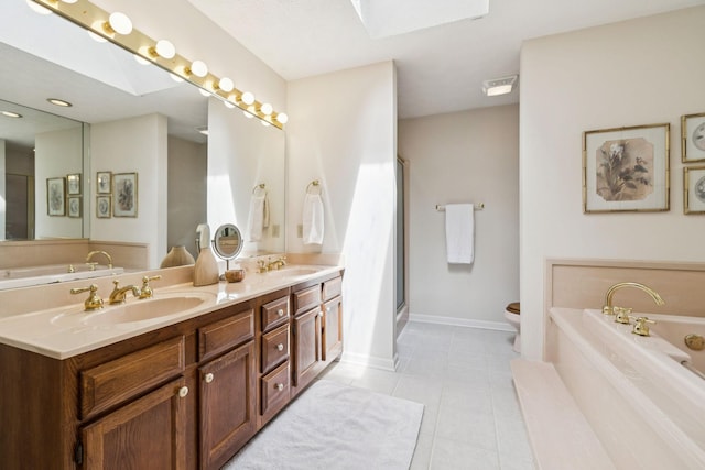 217 Fox Hunt Ln, Lebanon, TN 37087 - bathroom with a garden tub, a skylight, double vanity, tile patterned floors, and a shower with door