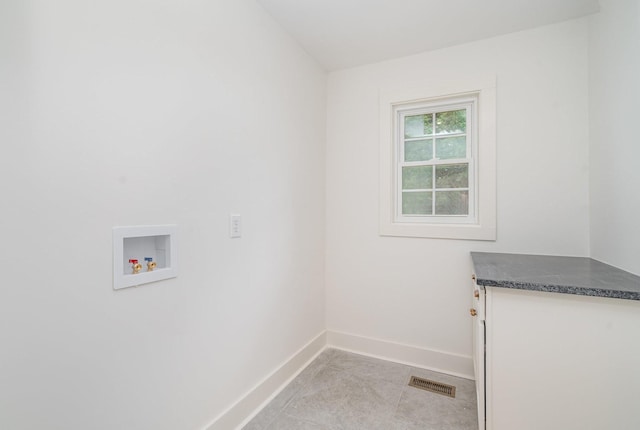 1026 Carthage Hwy, Lebanon, TN 37087 - washroom featuring washer hookup and light tile patterned floors
