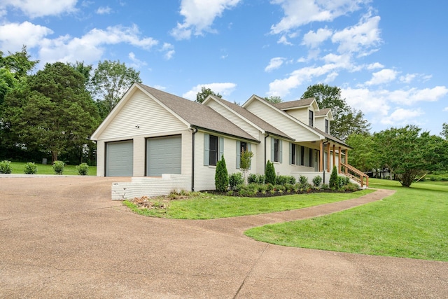 1026 Carthage Hwy, Lebanon, TN 37087 - view of side of property with driveway, a garage, a lawn, and roof with shingles