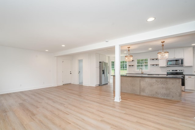 1026 Carthage Hwy, Lebanon, TN 37087 - unfurnished living room with recessed lighting and light wood-type flooring
