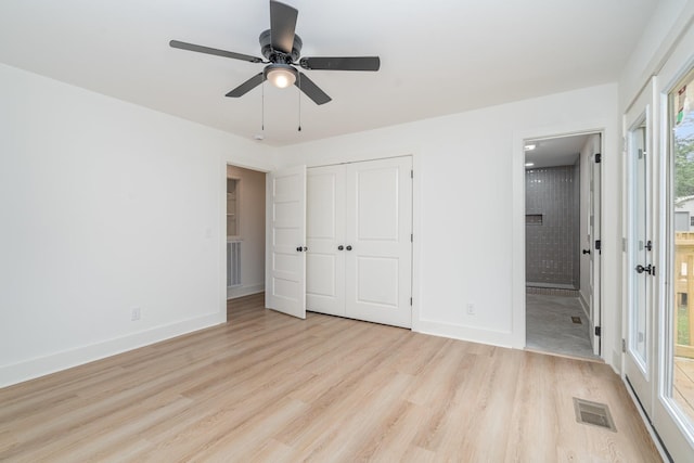 1026 Carthage Hwy, Lebanon, TN 37087 - unfurnished bedroom featuring light wood finished floors, multiple windows, a closet, and ensuite bath