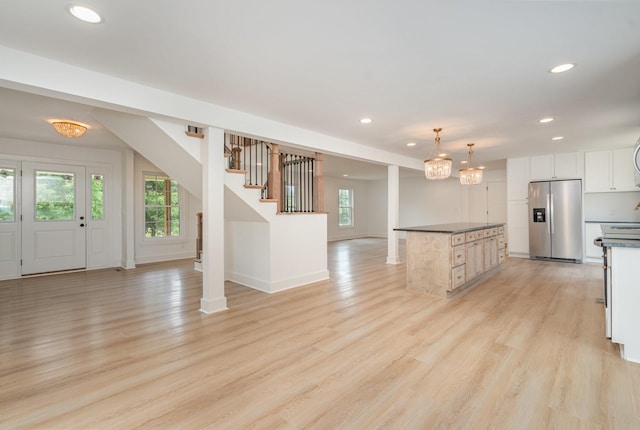 1026 Carthage Hwy, Lebanon, TN 37087 - kitchen featuring stainless steel fridge with ice dispenser, plenty of natural light, recessed lighting, dark countertops, and light wood-type flooring