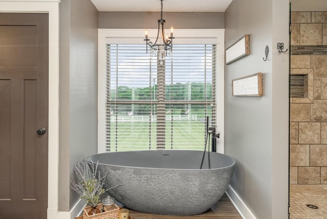 398 Beasleys Bend Rd, Lebanon, TN 37087 - full bath featuring a freestanding tub and a chandelier