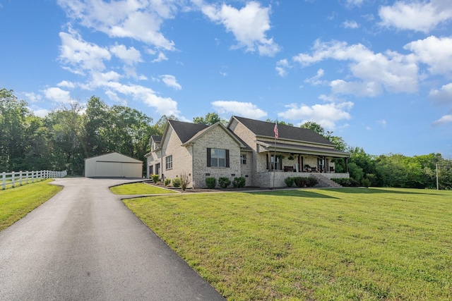 398 Beasleys Bend Rd, Lebanon, TN 37087 - view of front of property with a detached garage, a porch, brick siding, and an outdoor structure