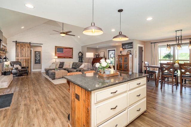 398 Beasleys Bend Rd, Lebanon, TN 37087 - kitchen with a barn door, vaulted ceiling, light wood-style floors, open floor plan, and a ceiling fan