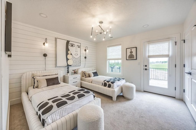 1224 Ben Forkum Dr, Lebanon, TN 37087 - bedroom featuring light carpet, access to outside, a chandelier, and wooden walls