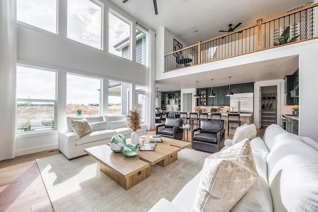 1224 Ben Forkum Dr, Lebanon, TN 37087 - living area with a ceiling fan, plenty of natural light, a high ceiling, and light wood-style floors