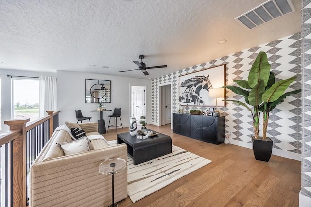 1224 Ben Forkum Dr, Lebanon, TN 37087 - living area with a textured ceiling, wood finished floors, and a ceiling fan