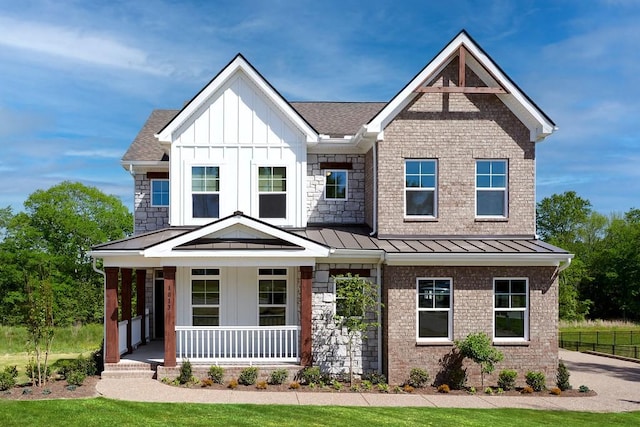 1107 Willow Springs Dr, Lebanon, TN 37087 - view of front of property with covered porch, board and batten siding, a standing seam roof, and roof with shingles
