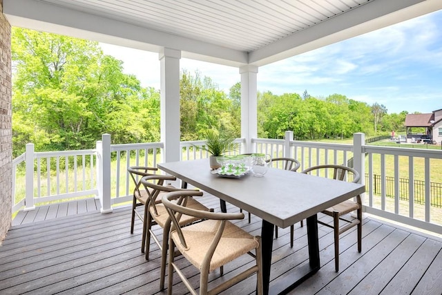 1107 Willow Springs Dr, Lebanon, TN 37087 - deck with outdoor dining space and view of wooded area
