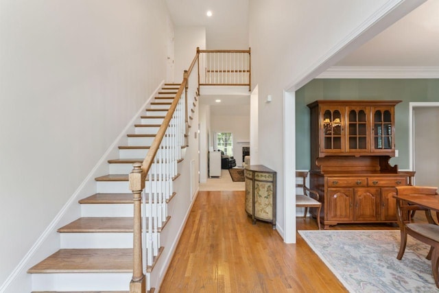 7125 Locksley Ln, Fairview, TN 37062 - stairway with wood finished floors, ornamental molding, and recessed lighting
